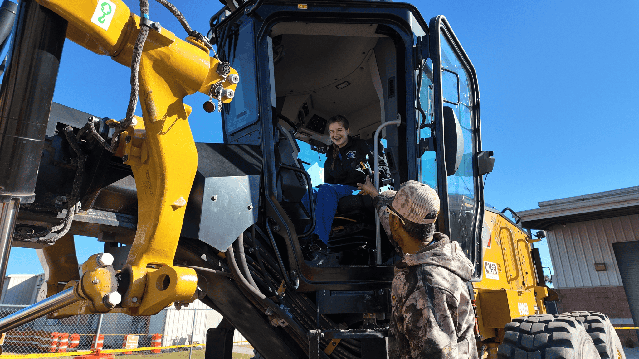 Construction worker with heavy equipment